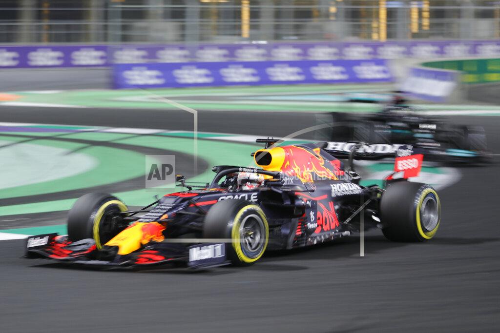 Amr Nabil Red Bull driver Max Verstappen of the Netherlands in action during the Formula One corniche circuit, in Jiddah, Saudi Arabia, Sunday, Dec. 5, 2021. (AP Photo/Amr Nabil)
