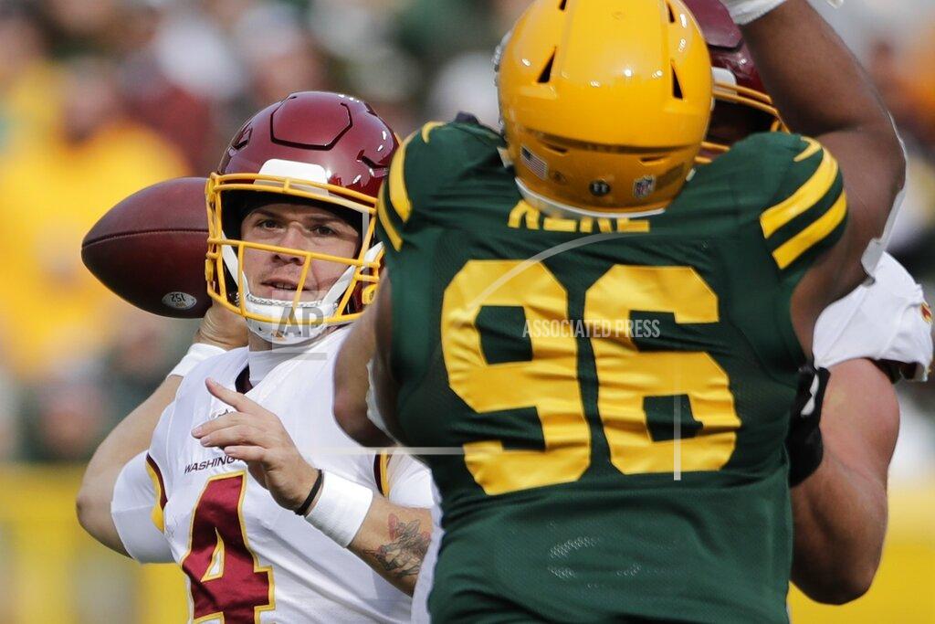 Aaron Gash Washington Football Team's Taylor Heinicke throws during the first half of an NFL football game against the Green Bay Packers Sunday, Oct. 24, 2021, in Green Bay, Wis. (AP Photo/Aaron Gash)