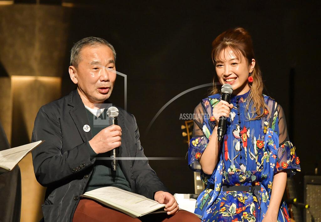 Uncredited In this photo provided by TOKYO FM, Japanese author Haruki Murakami, left, talks with guitarist Kaori Muraji during a show in Tokyo Sunday, Feb. 14, 2021. Murakami has a remedy for those who need relaxation from stress and worries in time of a pandemic - Brazilian Bossa nova music. During the approximately two-hour show, he recited his 1982 short story “The1963/1982 Girl from Ipanema,” in which a narrator details his memory of his meeting with a metaphysical girl from the song, with live guitar performed by his guest Muraji. (TOKYO FM via AP)