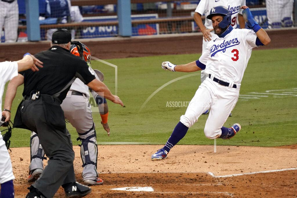 Alex Gallardo Los Angeles Dodgers' Chris Taylor, right, slides into home to beat the throw to Houston Astros catcher Martin Maldonado, second from left, on a two-run single by Enrique Hernandez, during the fifth inning of a baseball game in Los Angeles, Sunday, Sept. 13, 2020. (AP Photo/Alex Gallardo)