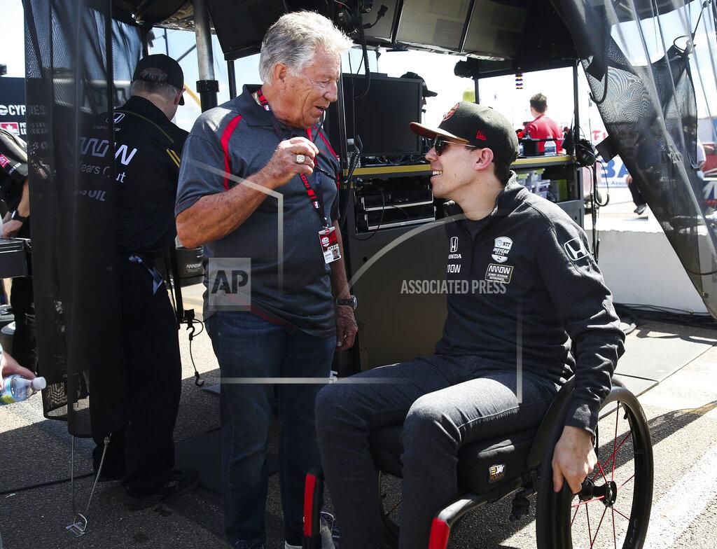 Dirk Shadd Auto Racing legend Mario Andretti,left, talks with Robert Wickens at the IndyCar Grand Prix of St. Petersburg auto race in St. Petersburg, Fla. Friday, March 8, 2019. Wickens returned to a race track for the first time since he suffered a major spinal cord injury in a crash six months ago. (Dirk Shadd/Tampa Bay Times via AP)
