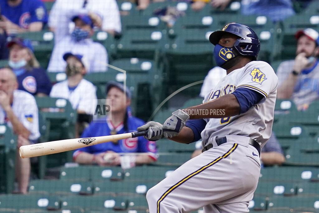 Nam Y. Huh Milwaukee Brewers' Lorenzo Cain watches after hitting a three-run home run against the Chicago Cubs during the 10th inning of a baseball game in Chicago, Wednesday, April 7, 2021. (AP Photo/Nam Y. Huh)