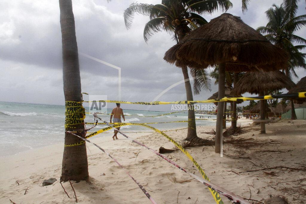 Tomas Stargardter Tape closing off the beach blows in the wind before the arrival of Tropical Storm Zeta in Playa del Carmen, Mexico, Monday, Oct. 26, 2020. A strengthening Tropical Storm Zeta is expected to become a hurricane Monday as it heads toward the eastern end of Mexico's resort-dotted Yucatan Peninsula and then likely move on for a possible landfall on the central U.S. Gulf Coast at midweek. (AP Photo/Tomas Stargardter)