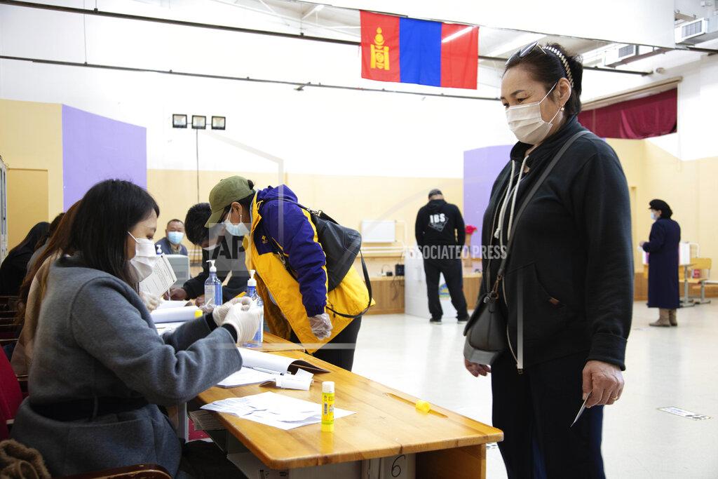 Saruul Enkhbold Residents arrive to cast their votes for the presidential elections at the Bayanzurkh district in Ulaanbaatar, Mongolia Wednesday, June 9, 2021. Mongolians began voting Wednesday for a new president amid COVID-19 restrictions and efforts to revive the economy of the vast landlocked nation of just 3 million people. (AP Photo/ Saruul Enkhbold)