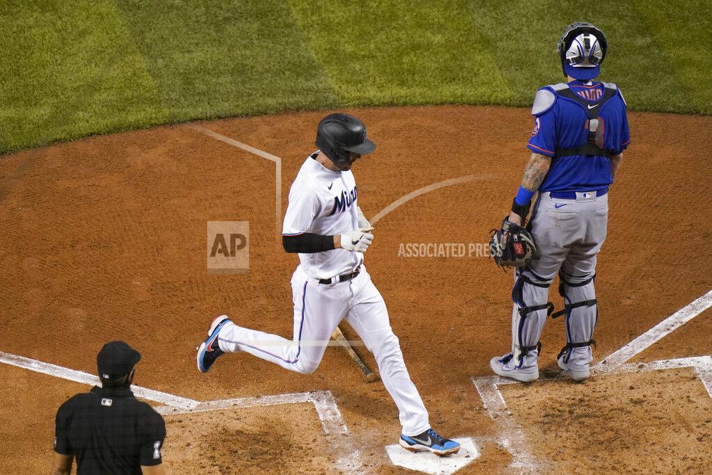 Lynne Sladky Miami Marlins' Matt Joyce scores on a double hit by Jesus Aguilar during the fourth inning of a baseball game against the New York Mets, Tuesday, Aug. 18, 2020, in Miami. (AP Photo/Lynne Sladky)