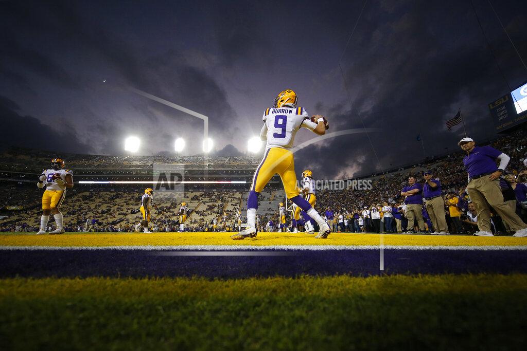 Gerald Herbert LSU quarterback Joe Burrow (9), a senior who is considered a frontrunner for the Heisman Trophy, warms up for his last NCAA college football game in Tiger Stadium, against Texas A&M in Baton Rouge, La., Saturday, Nov. 30, 2019. (AP Photo/Gerald Herbert)