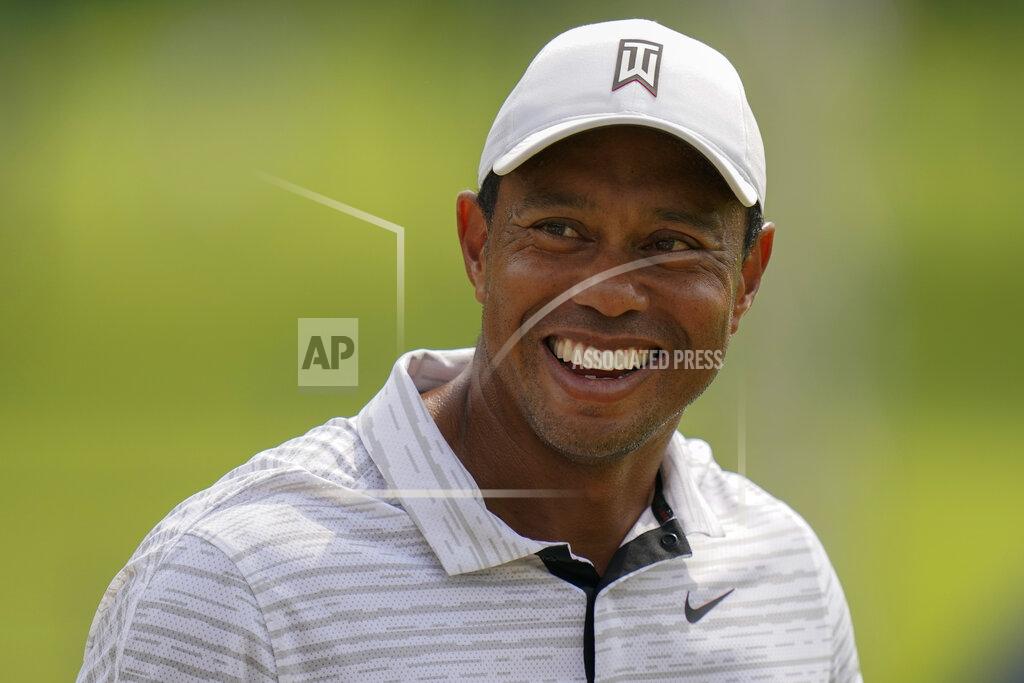 Eric Gay Tiger Woods smiles on the driving range before a practice round for the PGA Championship golf tournament, Tuesday, May 17, 2022, in Tulsa, Okla. (AP Photo/Eric Gay)