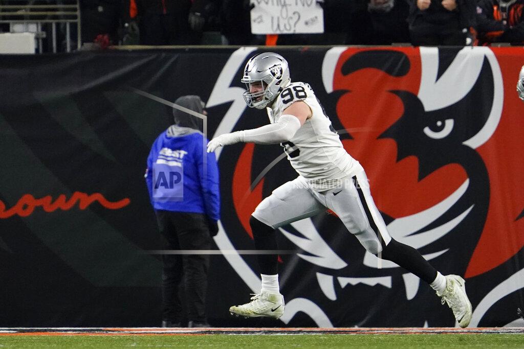 Jeff Dean Las Vegas Raiders' Maxx Crosby (98) celebrates after sacking Cincinnati Bengals quarterback Joe Burrow during the second half of an NFL wild-card playoff football game, Saturday, Jan. 15, 2022, in Cincinnati. (AP Photo/Jeff Dean)
