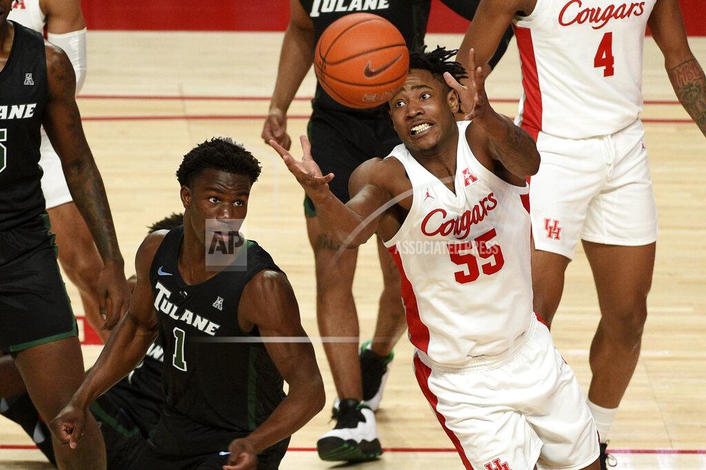 Eric Christian Smith Houston forward Brison Gresham (55) grabs a rebound as Tulane guard Sion James (1) defends during the first half of an NCAA college basketball game, Saturday, Jan. 9, 2021, in Houston. (AP Photo/Eric Christian Smith)