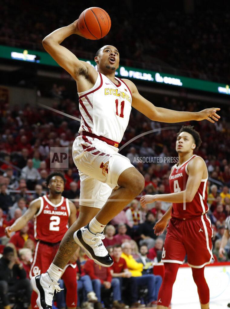 Charlie Neibergall Iowa State guard Talen Horton-Tucker (11) drives to the basket past Oklahoma's Aaron Calixte (2) and Jamuni McNeace, right, during the second half of an NCAA college basketball game, Monday, Feb. 25, 2019, in Ames, Iowa. (AP Photo/Charlie Neibergall)