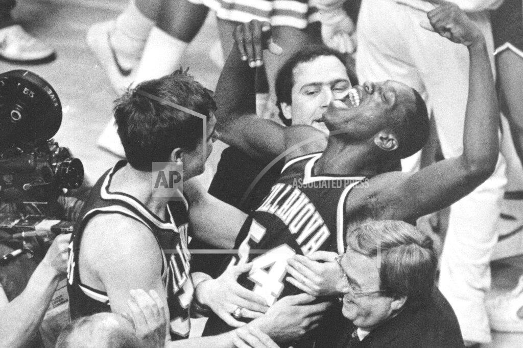 Gary Landers FILE - In this April 1, 1985, file photo, Villanova's Ed Pinckney (54) yells out as he is surrounded by teammates after defeating Georgetown 66-64 in the NCAA college basketball Final Four championship game, in Lexington, Ky. (AP Photo/Gary Landers, File)