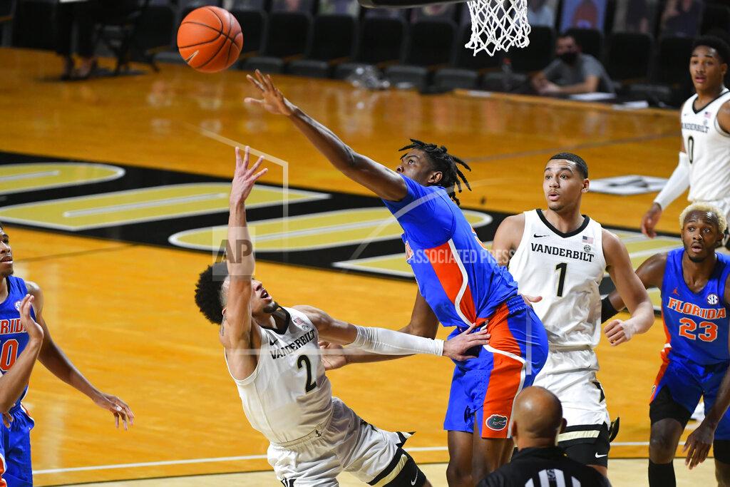 John Amis Florida forward Omar Payne blocks a shot by Vanderbilt guard Scotty Pippen Jr. (2) during the first half of an NCAA college basketball game Wednesday, Dec. 30, 2020, in Nashville, Tenn. (AP Photo/John Amis)