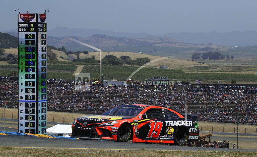 Ben Margot Martin Truex Jr. (19) competes during a NASCAR Sprint Cup Series auto race Sunday, June 23, 2019, in Sonoma, Calif. (AP Photo/Ben Margot)