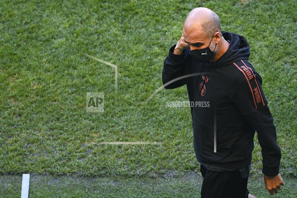 Franck Fife Manchester City's head coach Pep Guardiola walks on the pitch of the Jose Alvalade stadium in Lisbon, Friday Aug. 14, 2020. Manchester City will play Lyon in a Champions League quarterfinals soccer match on Saturday. (Franck Fife/Pool via AP)