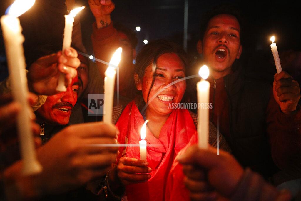 Niranjan Shrestha Nepalese supporters of the splinter group in the governing Nepal Communist Party celebrate the Supreme Court order in Kathmandu, Nepal, Tuesday, Feb. 23, 2021. Nepal's Supreme Court on Tuesday ordered the reinstatement of Parliament after it was dissolved by the prime minister, in a ruling likely to thrust the Himalayan nation into a political crisis. (AP Photo/Niranjan Shrestha)