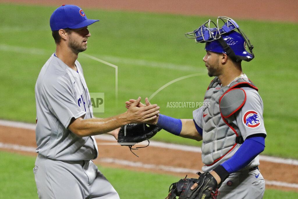 Tony Dejak Chicago Cubs relief pitcher Colin Rea, left, is congratulated by teammate Willson Contreras after the Cubs defeated the Cleveland Indians 7-1 in a baseball game, Tuesday, Aug. 11, 2020, in Cleveland. (AP Photo/Tony Dejak)