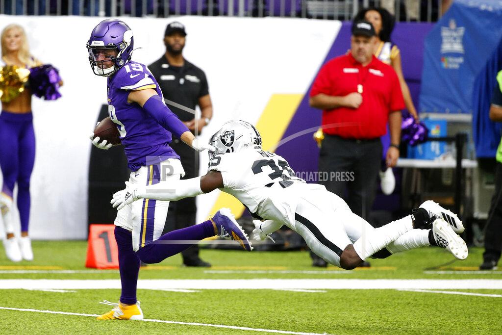 Bruce Kluckhohn Minnesota Vikings wide receiver Adam Thielen breaks a tackle by Oakland Raiders free safety Curtis Riley, right, during a 35-yard touchdown reception in the first half of an NFL football game, Sunday, Sept. 22, 2019, in Minneapolis. (AP Photo/Bruce Kluckhohn)