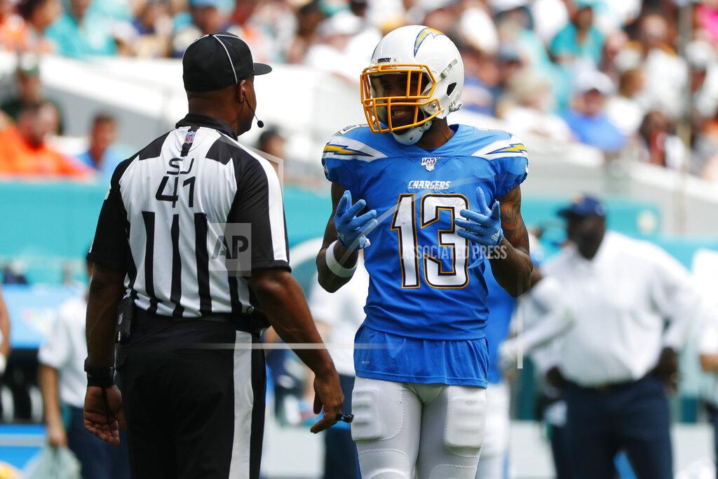 Wilfredo Lee Los Angeles Chargers wide receiver Keenan Allen (13) argues a call with side judge Anthony Jeffries, during the first half at an NFL football game against the Miami Dolphins, Sunday, Sept. 29, 2019, in Miami Gardens, Fla. Allen's touchdown was nullified due to offensive pass interference, (AP Photo/Wilfredo Lee)