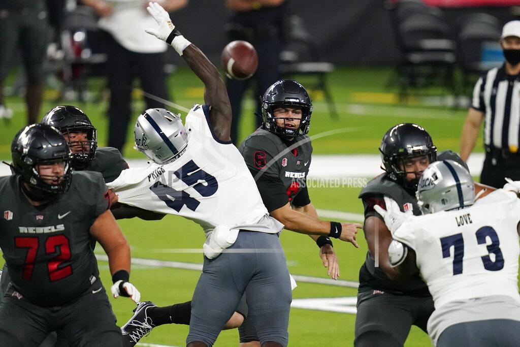 John Locher UNLV quarterback Max Gilliam (6) throws a pass against Nevada during the first half of an NCAA college football game Saturday, Oct. 31, 2020, in Las Vegas. (AP Photo/John Locher)