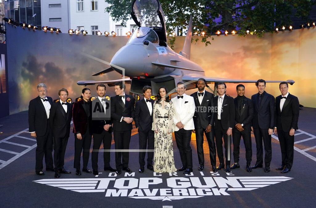 Alberto Pezzali From left, producer Christopher McQuarrie, producer Jerry Bruckheimer, Danny Ramirez, Glen Powell, Miles Teller, Tom Cruise, Jennifer Connolly, Jon Hamm, Jay Ellis, Lewis Pullman, Greg Tarzan Davis, director Joseph Kosinski and producer David Ellison pose for the media during the 'Top Gun Maverick' UK premiere at a central London cinema, on Thursday, May 19, 2022. (AP Photo/Alberto Pezzali)