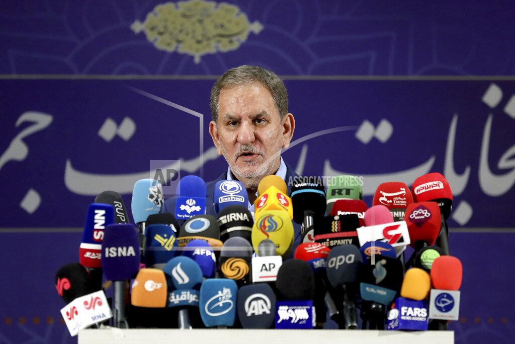 Ebrahim Noroozi Iranian Vice-President Eshaq Jahangiri speaks to media after registering his name as a candidate for the June 18 presidential elections at the elections headquarters of the Interior Ministry in Tehran, Iran, Saturday, May 15, 2021. (AP Photo/Ebrahim Noroozi)