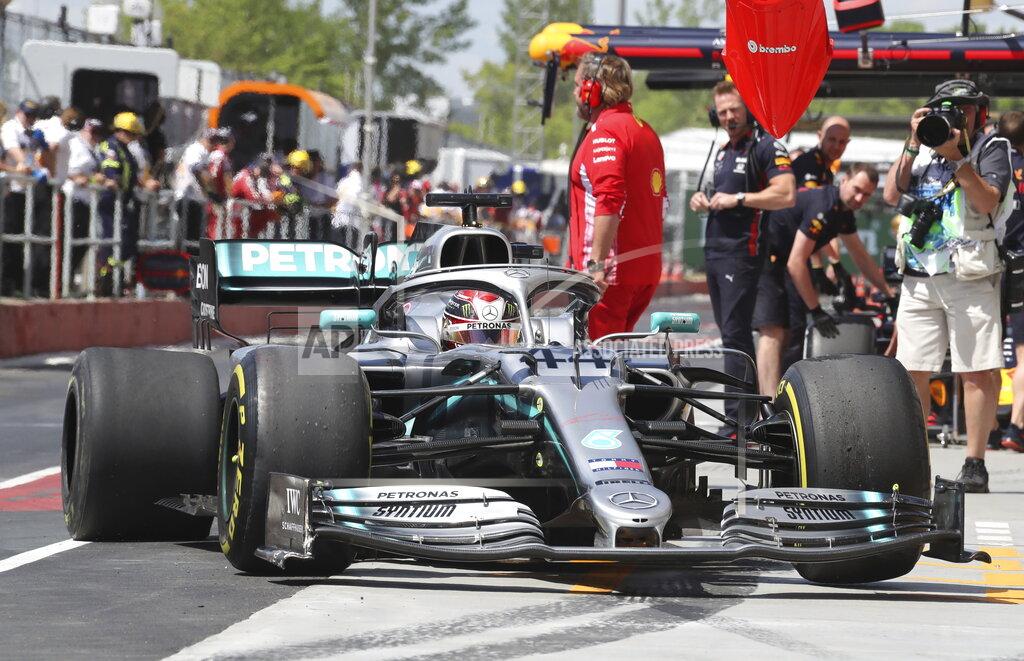 Tom Boland Mercedes driver Lewis Hamilton, of Britain, pulls into the pits with a broken rear tire after hitting the wall during the second practice session at the Formula One Canadian Grand Prix auto race, Friday, June 7, 2019, in Montreal. (Tom Boland/The Canadian Press via AP)
