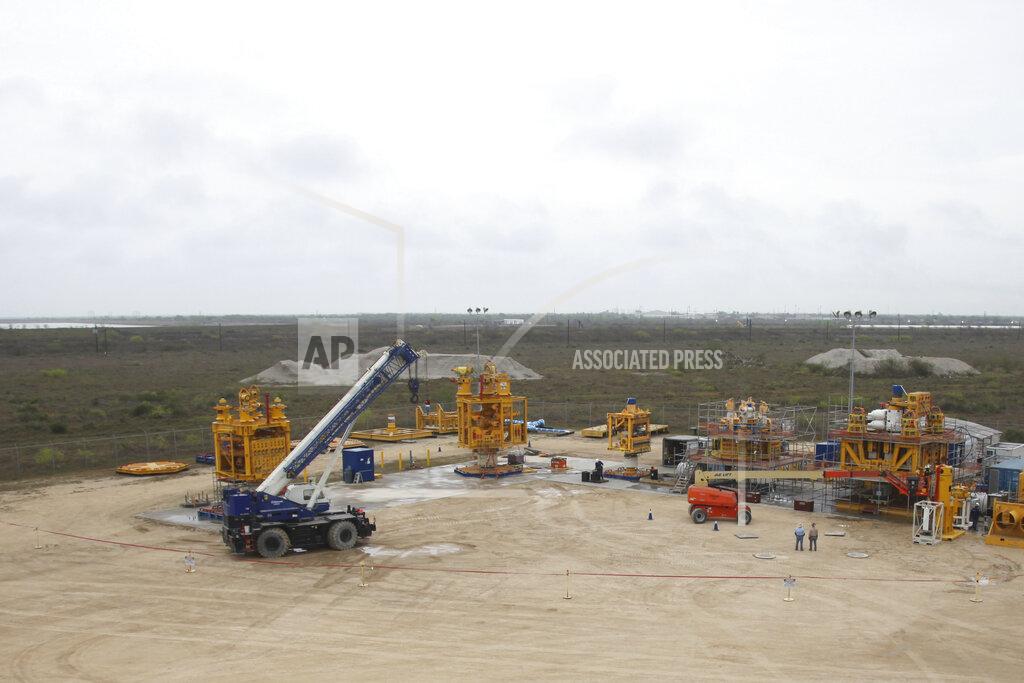 Jophn L. Mone In this Tuesday March 10, 2020 photo, the five cap stacks built by Marine Well Containment Company undergo rigorous pressure testing at the company yard in Ingleside, Texas. The devices help containment oil from blown out wells like the BP operated Macondo prospect which devastated the Gulf of Mexico ten years ago. (AP Photo/John L. Mone)