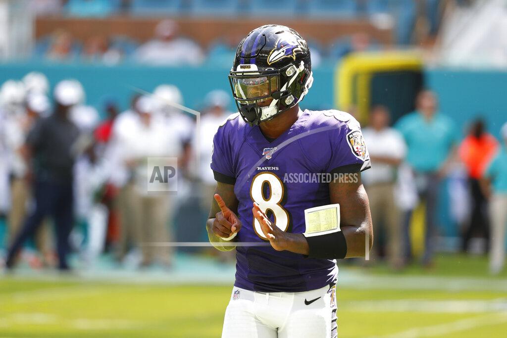 Wilfredo Lee Baltimore Ravens quarterback Lamar Jackson (8), gestures, during the second half at an NFL football game against the Miami Dolphins, Sunday, Sept. 8, 2019, in Miami Gardens, Fla. (AP Photo/Wilfredo Lee)