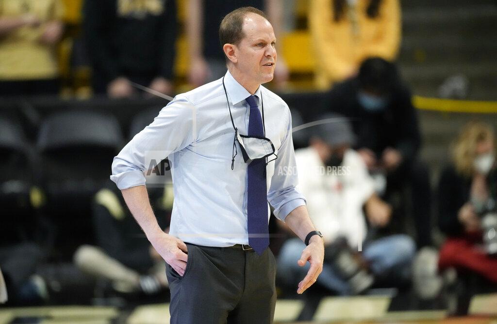 David Zalubowski Washington head coach Mike Hopkins directs his team against Colorado in the first first half of an NCAA college basketball game Sunday, Jan. 9, 2022, in Boulder, Colo. (AP Photo/David Zalubowski)