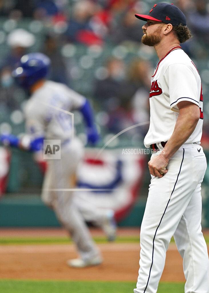 Tony Dejak Cleveland Indians starting pitcher Logan Allen, right, waits for Kansas City Royals Whit Merrifield to run the bases after Merrifield hit a two-run home run in the second inning of a baseball game, Monday, April 5, 2021, in Cleveland. (AP Photo/Tony Dejak)
