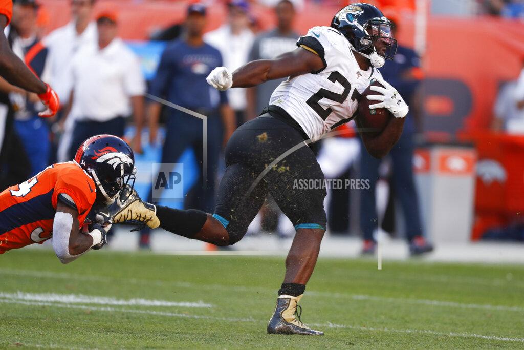 David Zalubowski Jacksonville Jaguars running back Leonard Fournette, right, runs with the ball during the second half of an NFL football game against the Denver Broncos, Sunday, Sept. 29, 2019, in Denver. (AP Photo/David Zalubowski)