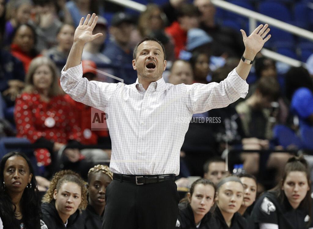 Chuck Burton FILE - In this Friday, March 8, 2019, file photo, Louisville head coach Jeff Walz directs his team against Clemson during the first half of an NCAA college basketball game in the Atlantic Coast Conference women's tournament in Greensboro, N.C. Knowing that cancellations and postponements of games would be the norm this season amid the coronavirus pandemic, Walz started a text chain with a dozen coaches so that they could schedule games at the last minute when cancellations happened. (AP Photo/Chuck Burton, File)