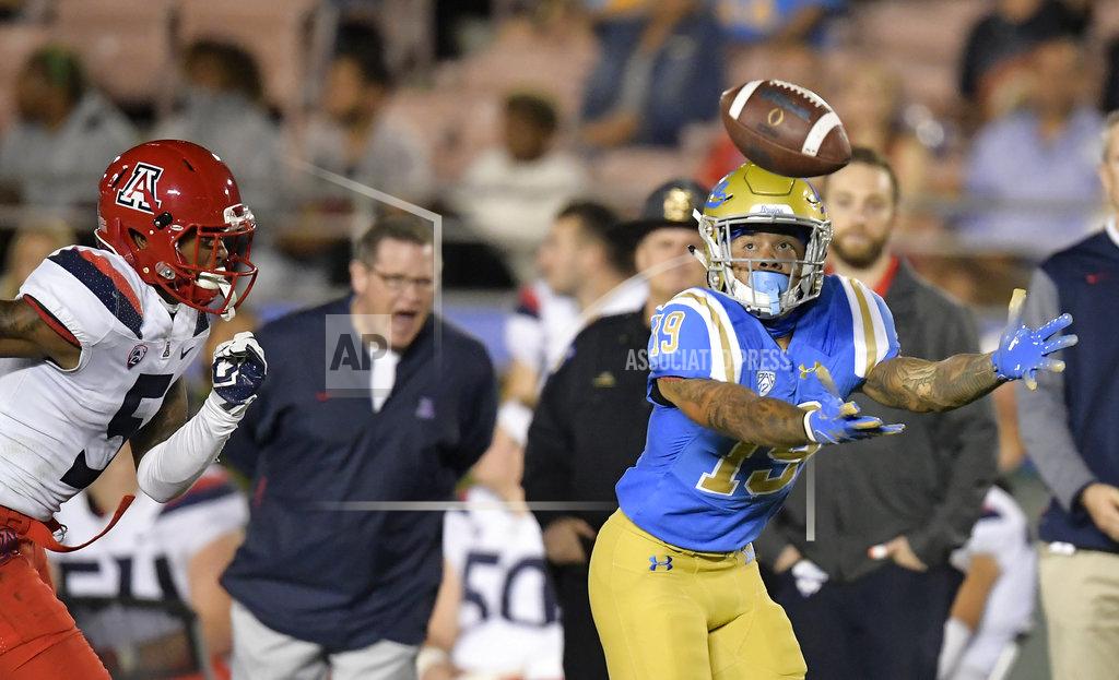 Mark J. Terrill UCLA running back Kazmeir Allen, right, can't hold on to a pass as Arizona safety Christian Young defends during the first half of an NCAA college football game, Saturday, Oct. 20, 2018, in Pasadena, Calif. (AP Photo/Mark J. Terrill)