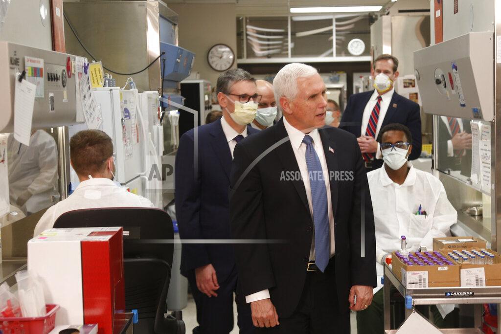 Jim Mone Vice President Mike Pence visits the molecular testing lab at Mayo Clinic Tuesday, April 28, 2020, in Rochester, Minn., where he toured the facilities supporting COVID-19 research and treatment. (AP Photo/Jim Mone)