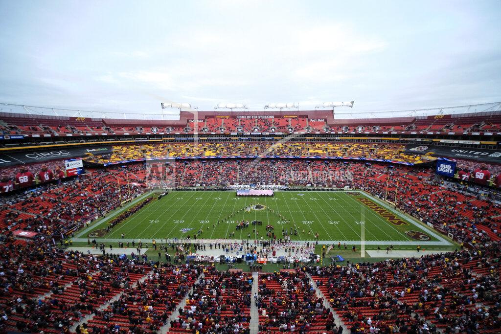 Mark Tenally FILE - In this Nov. 17, 2019, file photo, FedEx Field is seen in this general view during the National Anthem prior to an NFL football game between the New York Jets and Washington Redskins, in Landover, Md. There were more than 20,000 empty seats for the Redskins’ last home game, and when many of them have been filled this season, it’s with fans of the visiting team. It could be even emptier Sunday when the 1-9 Redskins host the 3-6-1 Detroit Lions. (AP Photo/Mark Tenally, File)