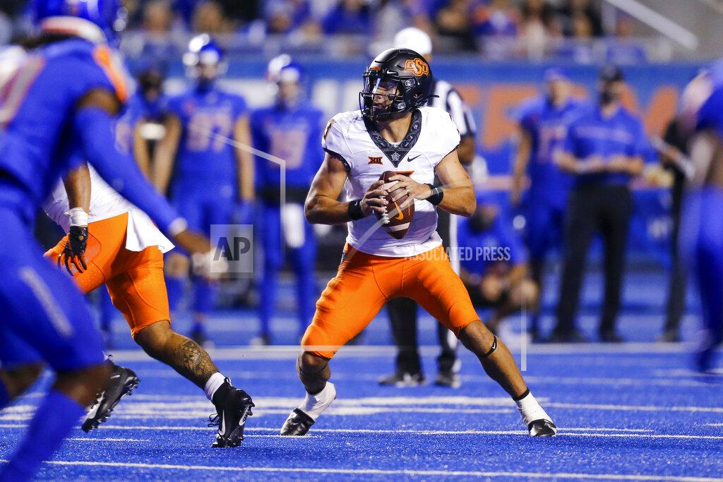 Steve Conner Oklahoma State quarterback Spencer Sanders drop back during the second half of the team's NCAA college football game against Boise State on Saturday, Sept. 18, 2021, in Boise, Idaho. (AP Photo/Steve Conner)
