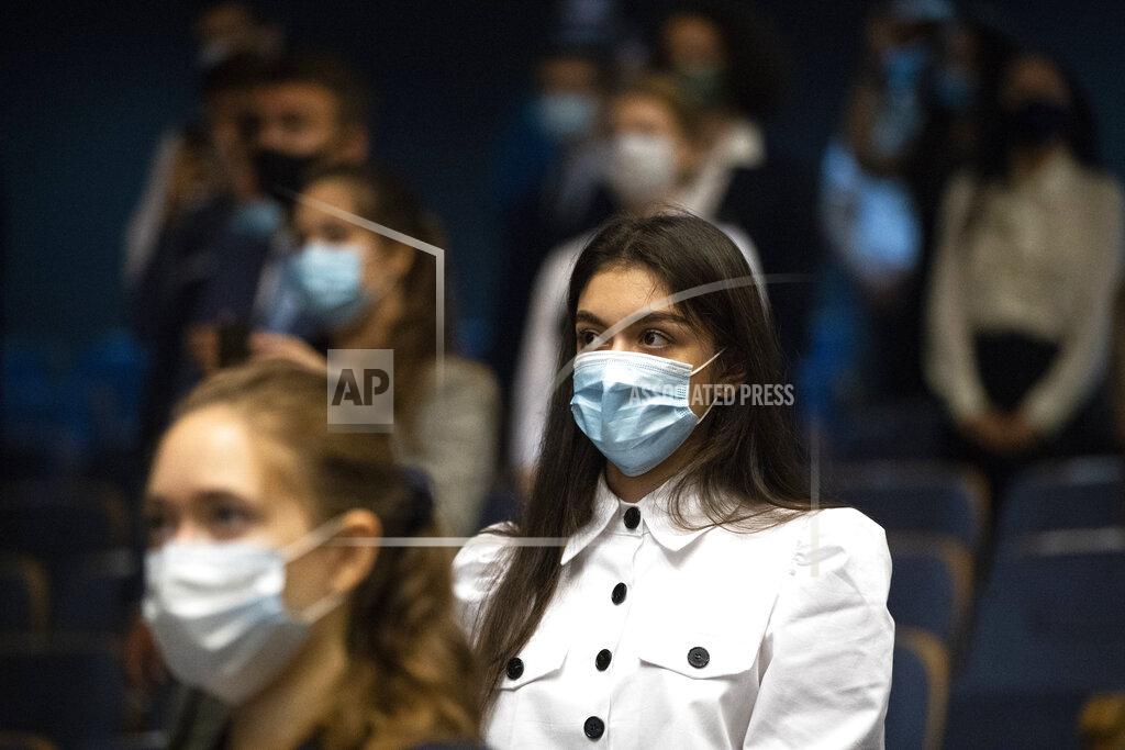 Pavel Golovkin Students of the MGIMO (Moscow State Institute for Foreign Relations) wearing face masks to protect against coronavirus attend a meeting with Russian Foreign Minister Sergey Lavrov in Moscow, Russia, Tuesday, Sept. 1, 2020. Russia's tally of confirmed coronavirus cases has surpassed 1 million after authorities reported 4,729 new cases. With a total of 1,000,048 reported cases up to Tuesday, Russia has the fourth largest caseload in the world after the U.S., Brazil and India. (AP Photo/Pavel Golovkin)