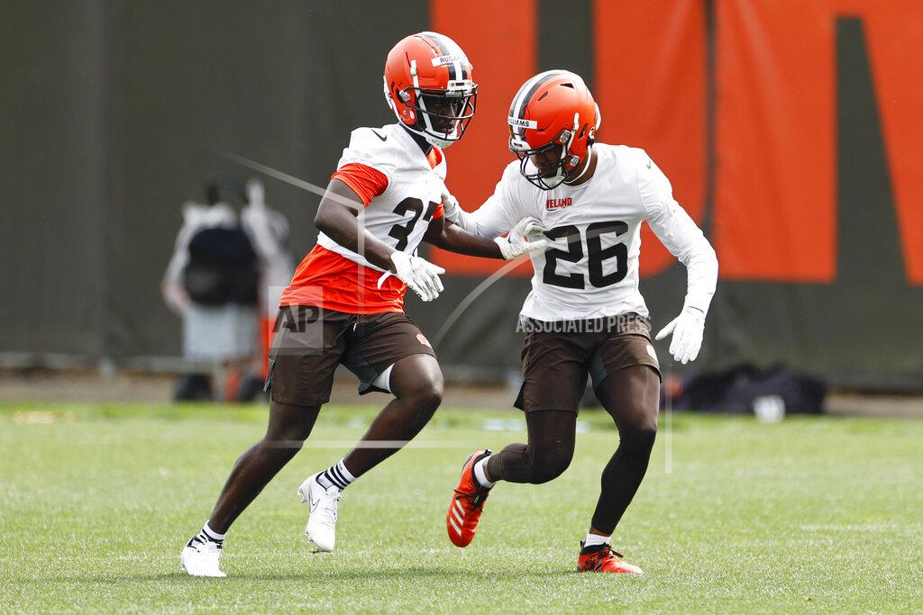Ron Schwane Cleveland Browns cornerback Greedy Williams (26) defends against Emmanuel Rugamba (37) during an NFL football practice at the team's training facility Wednesday, June 9, 2021, in Berea, Ohio. (AP Photo/Ron Schwane)