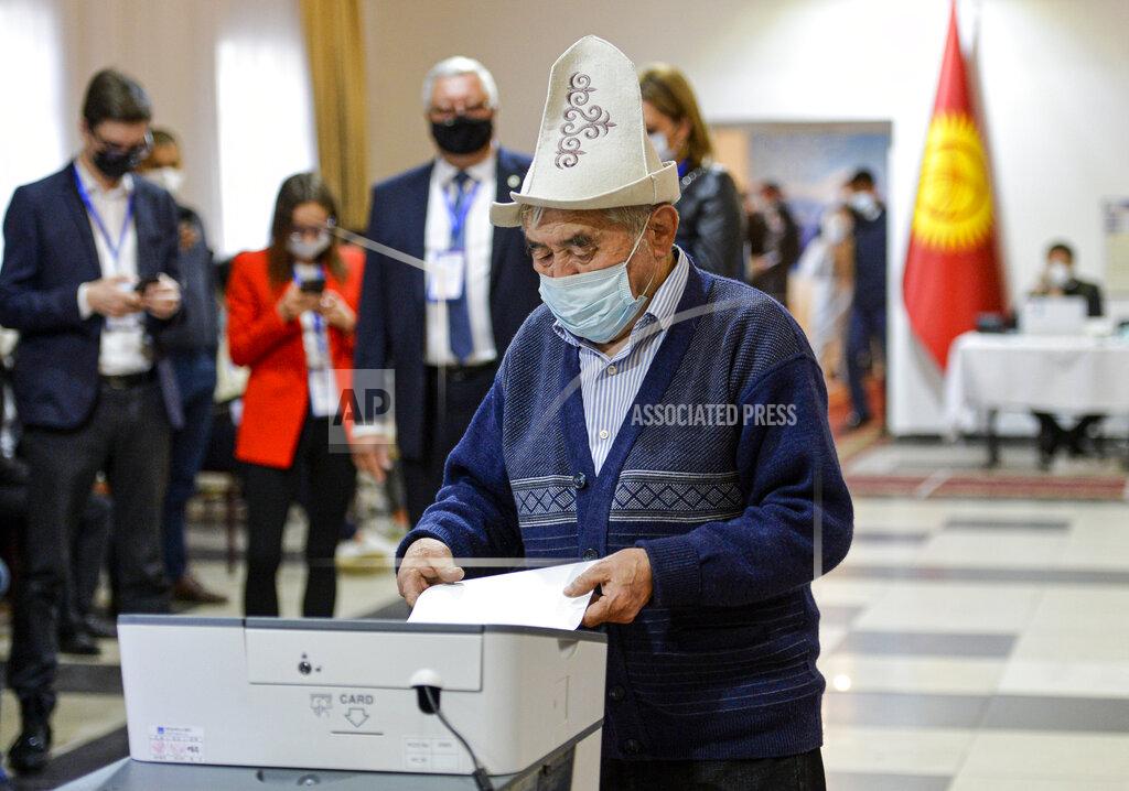 Vladimir Voronin A man in a Kyrgyz national hat casts his ballot at a polling station during the referendum in Bishkek, Kyrgyzstan, Sunday, April 11, 2021. Voters in Kyrgyzstan cast ballots Sunday on whether to approve a new constitution that would substantially increase the president's powers. The Sunday referendum comes three months after Sadyr Zhaparov was elected president, following the ouster of the previous president amid protests, the third time in 15 years that a leader of the Central Asian country had been driven from office in a popular uprising. (AP Photo/Vladimir Voronin)