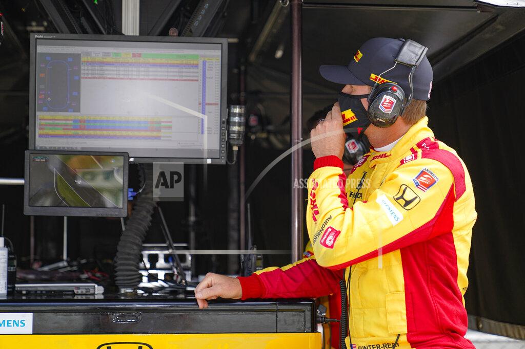 Michael Conroy Ryan Hunter-Reay looks over data during practice for the Indianapolis 500 auto race at Indianapolis Motor Speedway in Indianapolis, Friday, Aug. 14, 2020. (AP Photo/Michael Conroy)