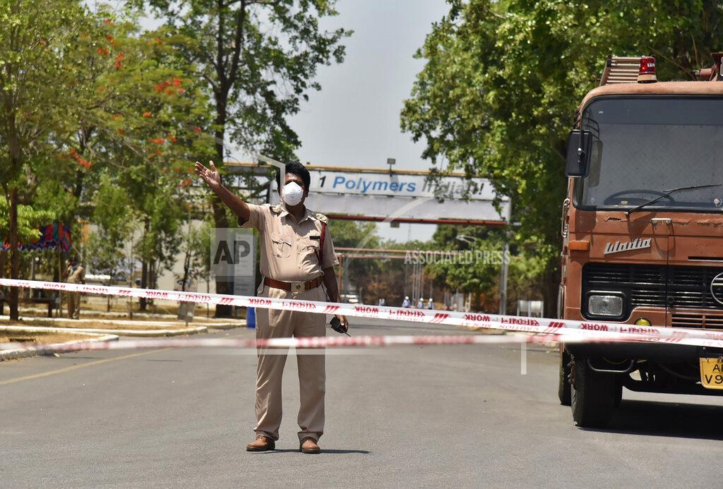 Uncredited A policeman stands guard near the LG Polymers plant, the site of a chemical gas leak, in Vishakhapatnam, India, Friday, May 8, 2020. Indian authorities evacuated more people from villages near a South Korean-owned chemical factory where a gas leak killed 12 people and left about 1,000 struggling to breathe. Authorities said the evacuation was precautionary, but it triggered panic among people overnight that another gas leak was occurring. (AP Photo)