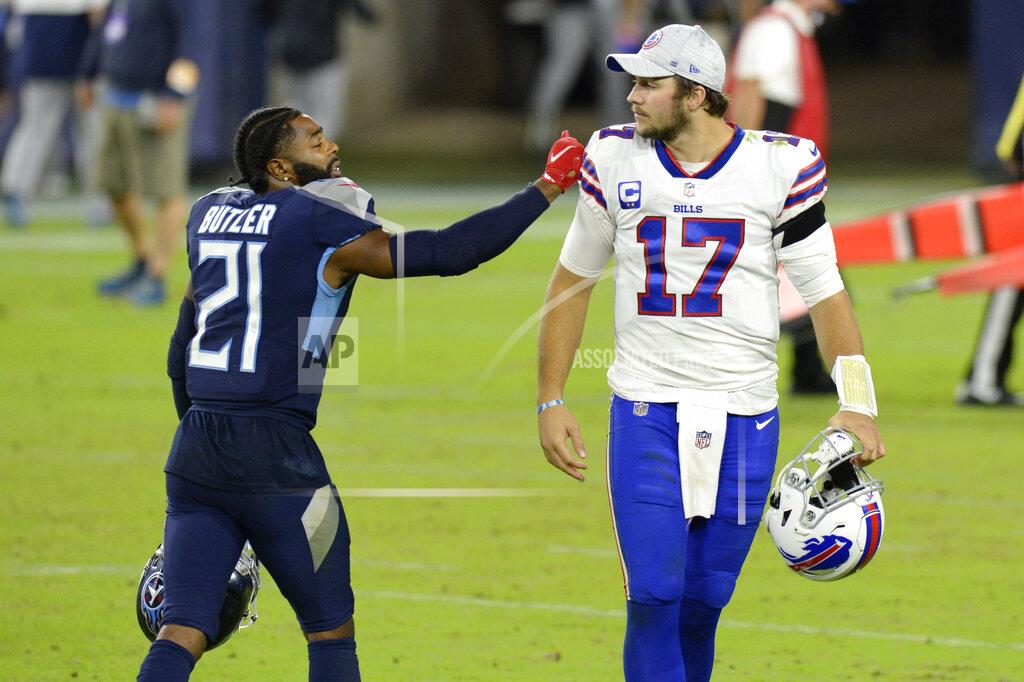 Mark Zaleski Tennessee Titans cornerback Malcolm Butler (21) talks with Buffalo Bills quarterback Josh Allen (17) after an NFL football game Tuesday, Oct. 13, 2020, in Nashville, Tenn. Butler intercepted Allen twice as the Titans won 42-16. (AP Photo/Mark Zaleski)
