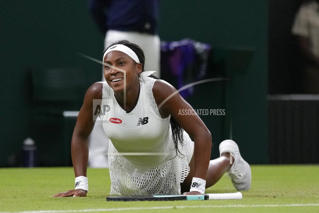 Kirsty Wigglesworth Coco Gauff of the US falls as she tries to make a return to Romania's Mihaela Buzarnescu in a second round women's singles match on day four of the Wimbledon tennis championships in London, Thursday, June 30, 2022. (AP Photo/Kirsty Wigglesworth)