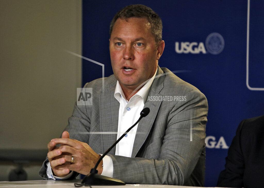 FILE - In this May 6, 2015, file photo , LPGA commissioner Mike Whan speaks during a press conference at The Players Championship golf tournament in Ponte Vedra Beach, Fla. The LPGA Tour is pushing back the restart of its season at least another month. The target now is a tournament in Michigan on July 15-18, and that depends on whether it's safe to return. Even three months away, LPGA commissioner Whan took note that next on the LPGA schedule were events in Michigan, Ohio and New Jersey, and said there would need to be improvement in the coronavirus situation for those tournaments to be played. (AP Photo/Chris O'Meara, File)