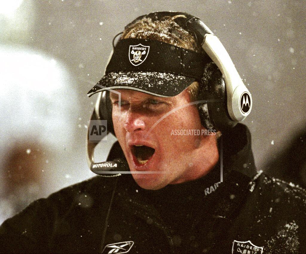 Winslow Townson File-Oakland Raiders head coach Jon Gruden shouts instructions during their overtime loss to the New England Patriots in an AFC Divisional playoff game in Foxboro, Mass. Saturday, Jan. 19, 2002. Gruden says opening this season at Carolina and then playing New Orleans on made him feel like he was time warp. His nostalgia is even more amplified this week against New England. It’s been nearly two decades since he walked out of a snow-covered Foxboro Stadium on the wrong end of a 16-13 overtime loss to the Patriots in the infamous “tuck rule” game during the 2001 playoffs. (AP Photo/Winslow Townson, File)