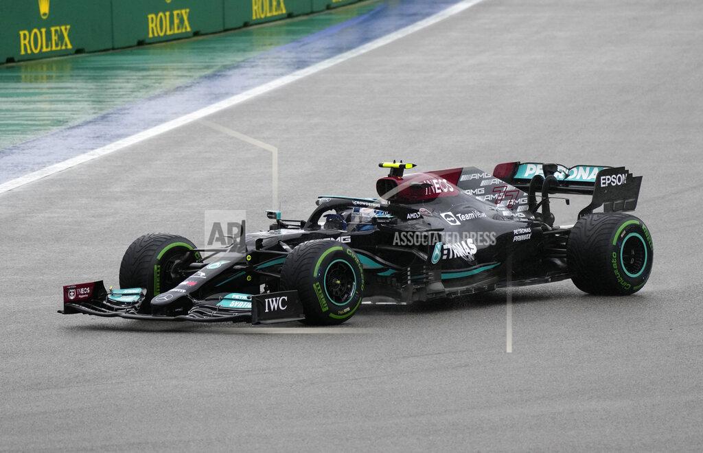 Sergei Grits Mercedes driver Lewis Hamilton of Britain steers his car during the qualifying session at the Sochi Autodrom circuit, in Sochi, Russia, Saturday, Sept. 25, 2021. The Russian Formula One Grand Prix will be held on Sunday. (AP Photo/Sergei Grits)