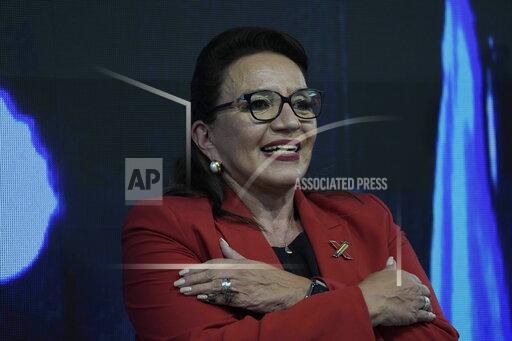 Free Party presidential candidate Xiomara Castro greets her supporters after general elections, in Tegucigalpa, Honduras, Sunday, Nov. 28, 2021. Castro claimed victory, setting up a showdown with the National Party which said its candidate had won a vote that could end the conservative party's 12 years in power. (AP Photo/Moises Castillo)