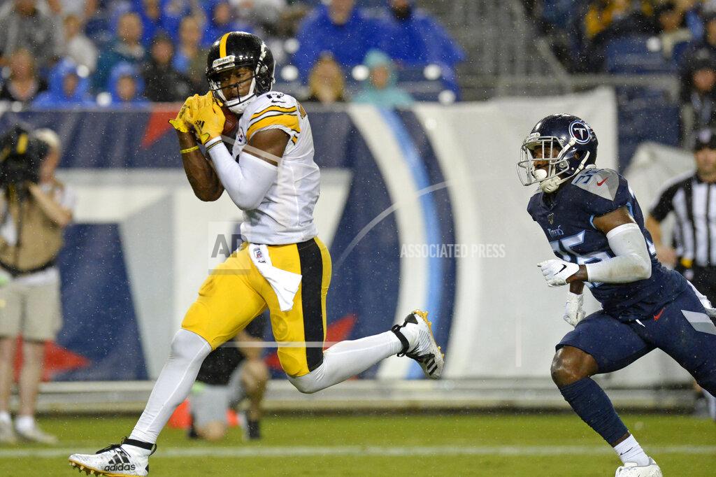 Mark Zaleski FILE - In this Aug. 25, 2019, file photo, Pittsburgh Steelers wide receiver JuJu Smith-Schuster catches a 17-yard touchdown pass ahead of Tennessee Titans cornerback LeShaun Sims (36) in the first half of a preseason NFL football game in Nashville, Tenn. Smith-Schuster is looking for a big bounce-back this season. (AP Photo/Mark Zaleski, File)