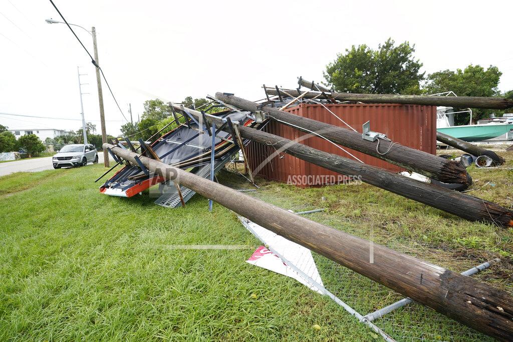 Wilfredo Lee An advertising billboard lies on the ground after falling from high winds and rain from Tropical Storm Eta, Monday, Nov. 9, 2020, in Key Largo, Fla. The storm had top sustained winds of 65 mph Sunday night as it crossed over the Florida Keys. (AP Photo/Wilfredo Lee)