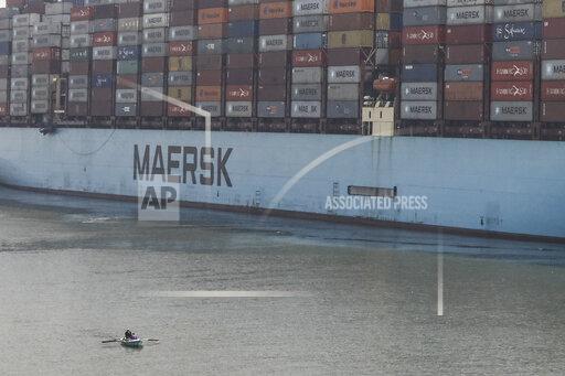 Mohamed Elshahed A container ship passes through Suez Canal, Egypt, Tuesday, April 6, 2021. The Suez Canal chief said that authorities are negotiating a financial settlement with the owners of a massive vessel that blocked the crucial waterway for nearly a week. (AP Photo/Mohamed Elshahed)